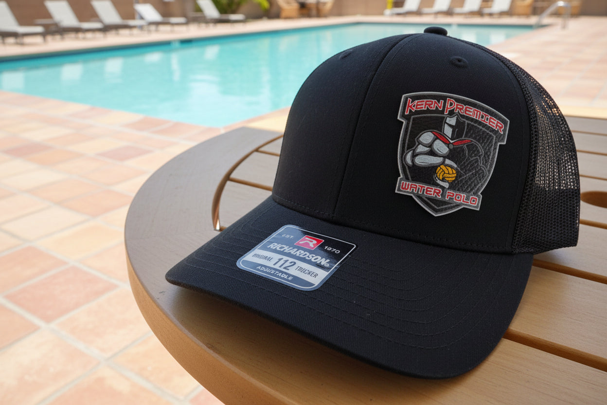 Black cap with a Kern Premier Crusader patch